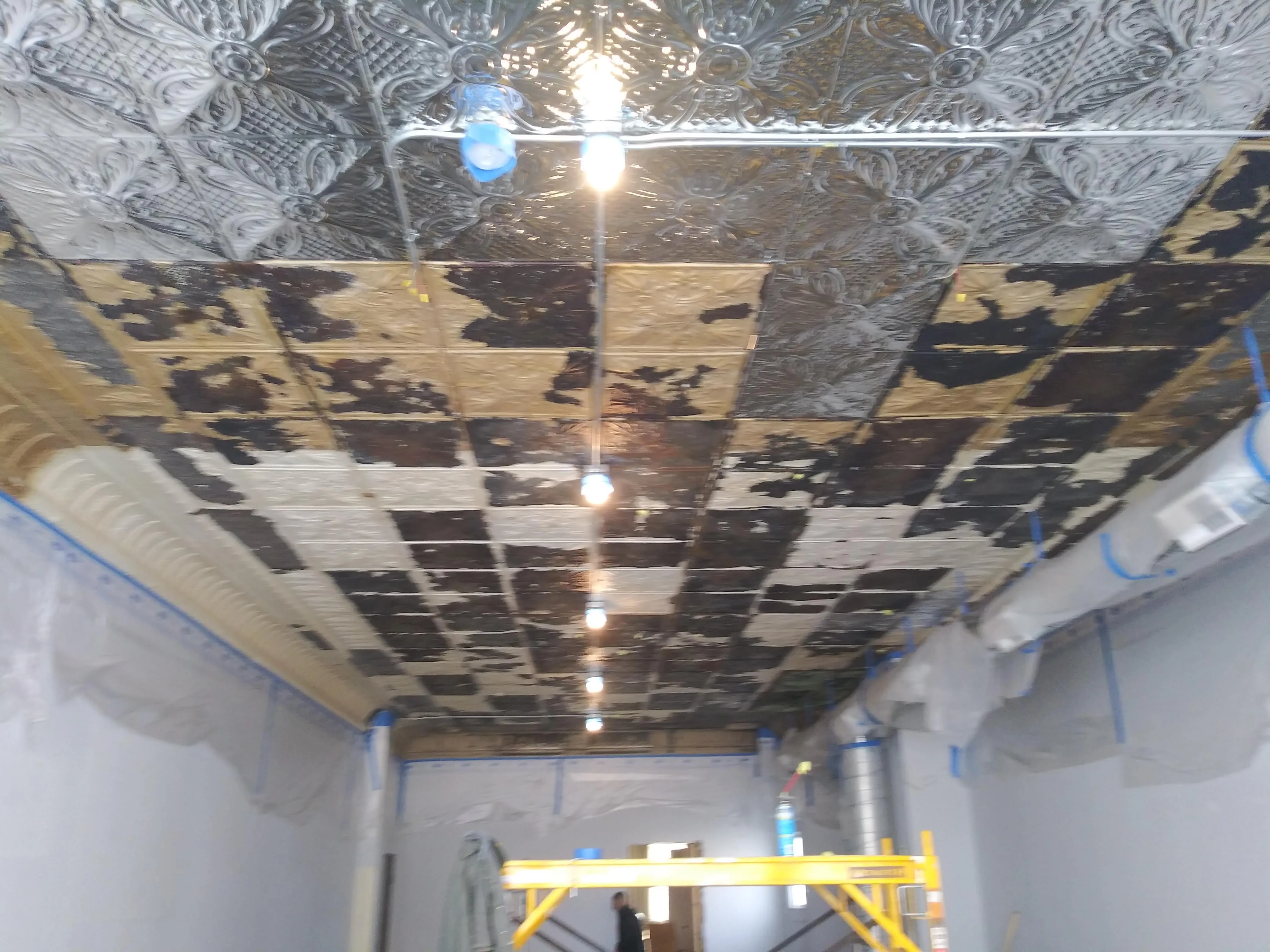 Tin ceiling before restoration
